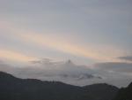 snow peaks tease us through the clouds