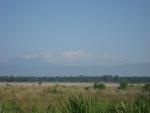 the snow-capped mountains are still visible from the plains