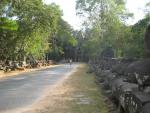 Heather cycles through the North gate of Angkor Thom