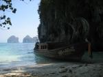 our longtail boat at anchor on the beach