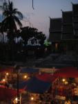 night market in Luang Prabang with a Wat in the background